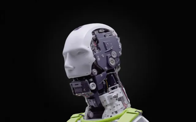 Advanced humanoid robot with exposed mechanical components against a black background